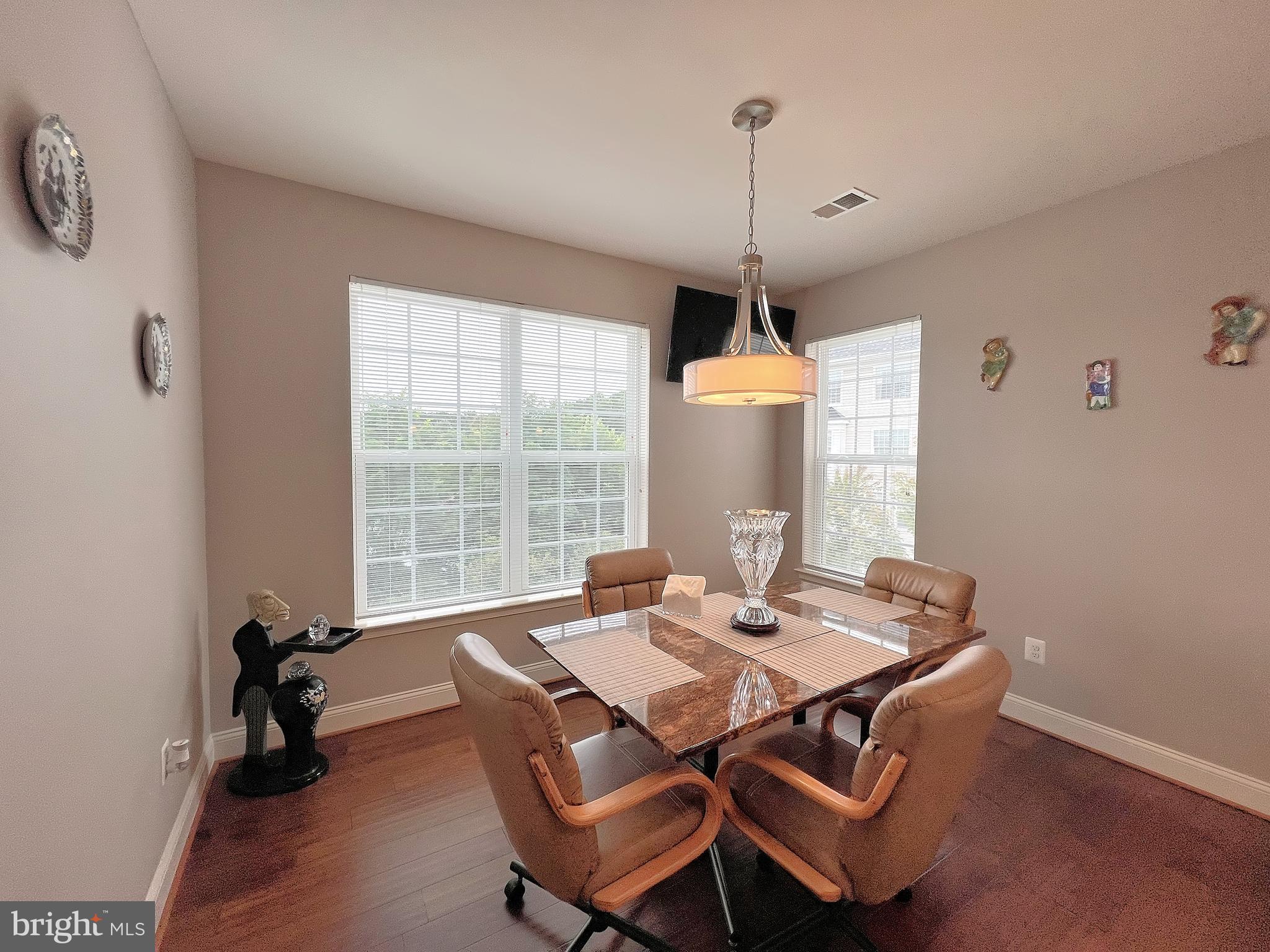 605 Quarry View Court, Unit 307 Reisterstown, MD 21136 - Photo 15 of 30 a view of a dining room with furniture window and outside view
