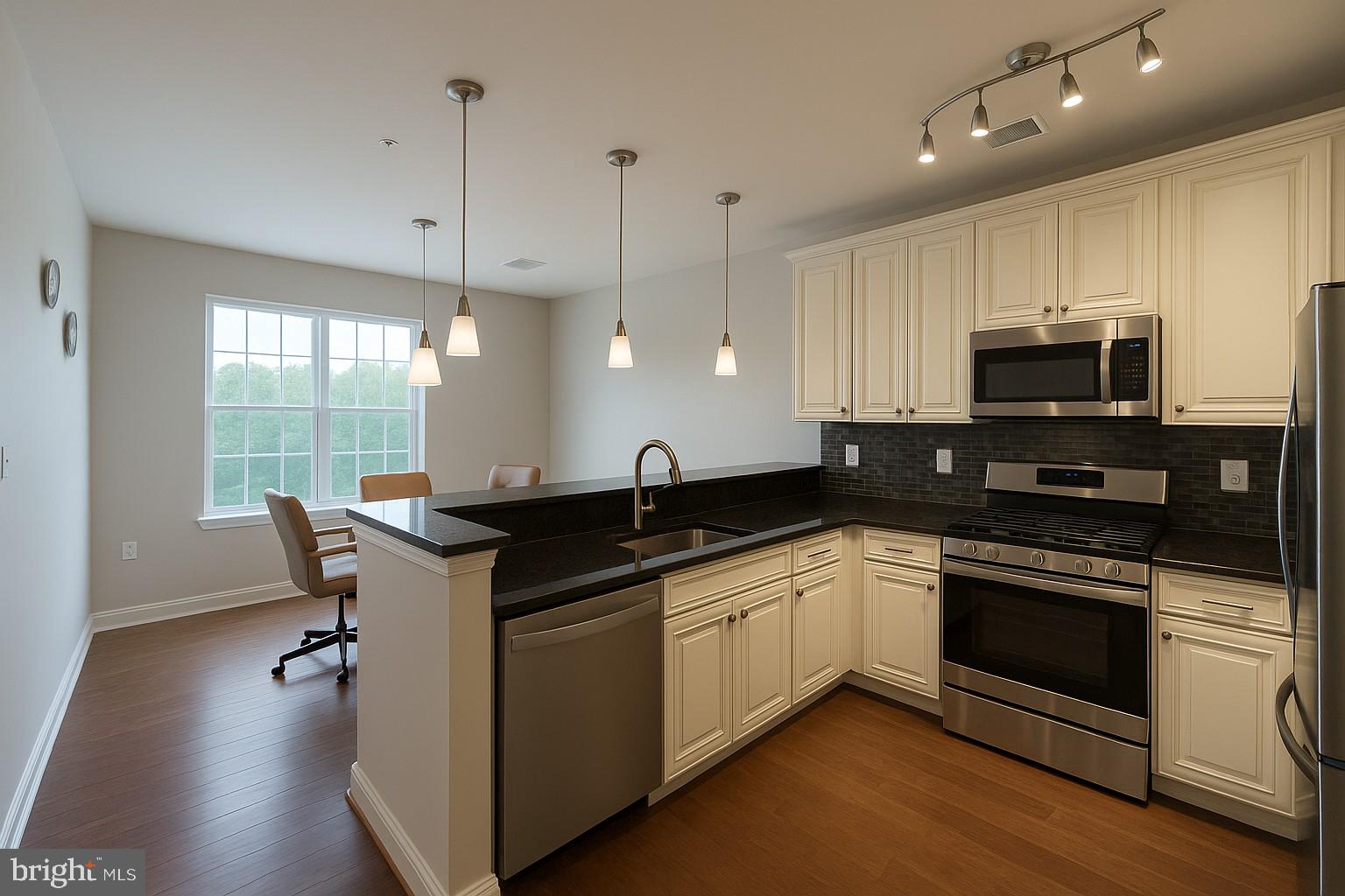 605 Quarry View Court, Unit 307 Reisterstown, MD 21136 - Photo 16 of 30 a kitchen with stainless steel appliances granite countertop a sink stove and refrigerator