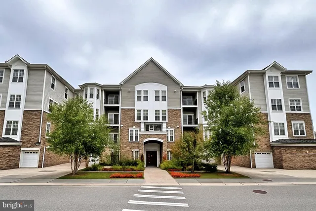 a front view of a residential houses with street