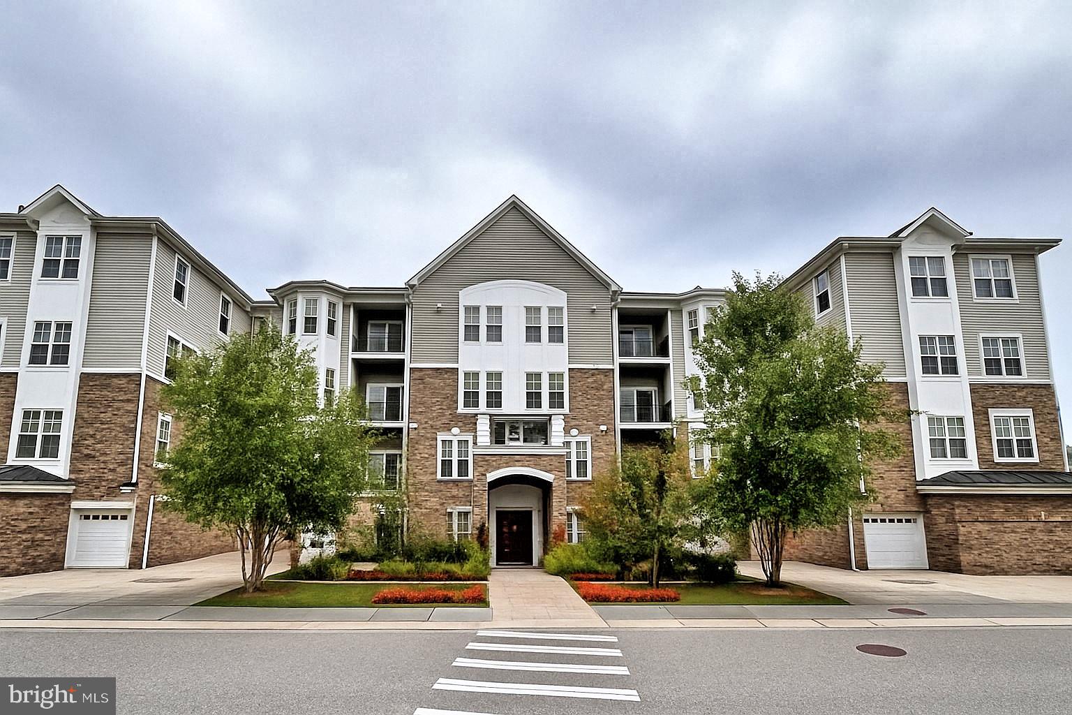 605 Quarry View Court, Unit 307 Reisterstown, MD 21136 - Photo 2 of 30 a front view of a residential houses with street