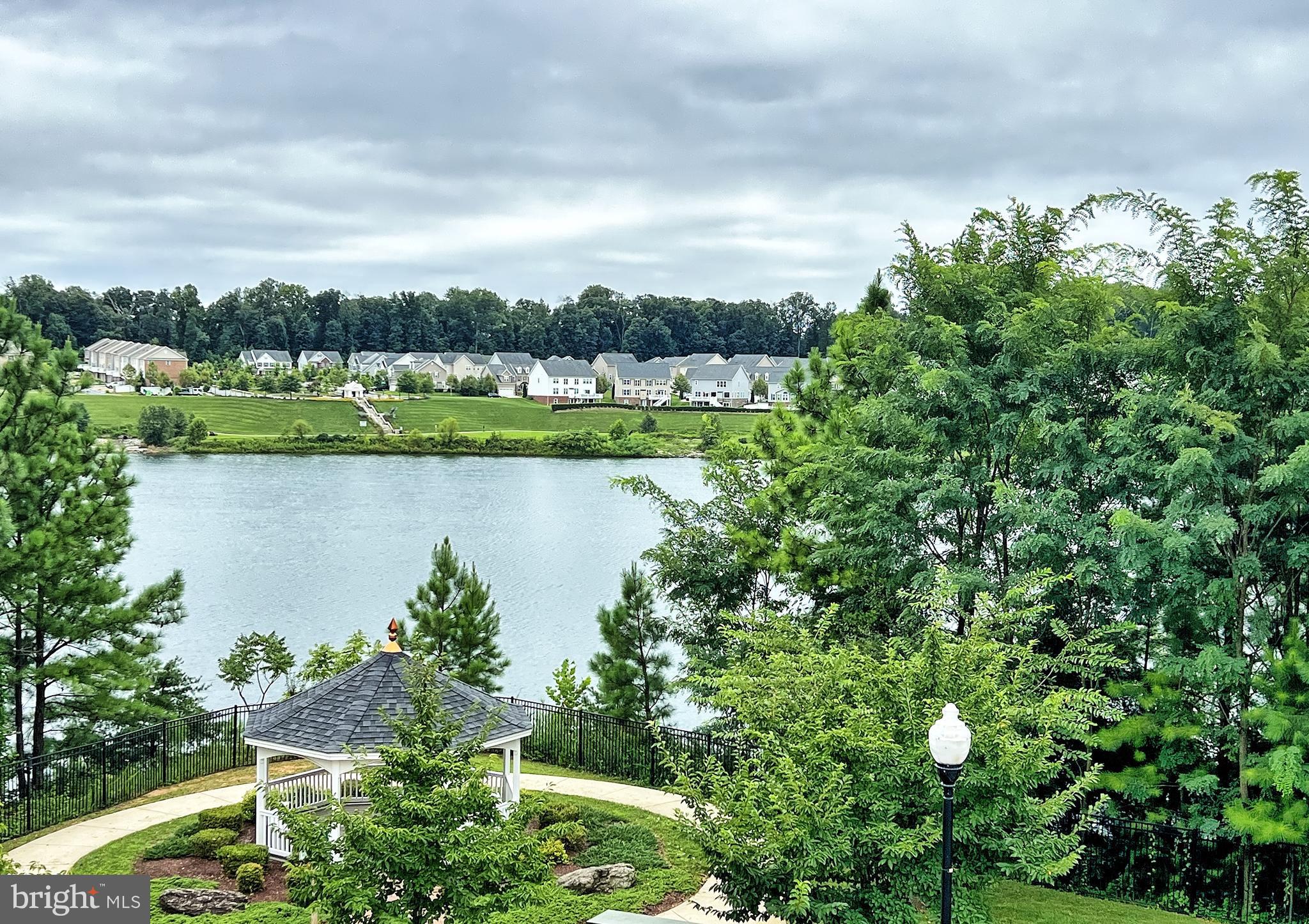 605 Quarry View Court, Unit 307 Reisterstown, MD 21136 - Photo 25 of 30 a view of a lake with a city