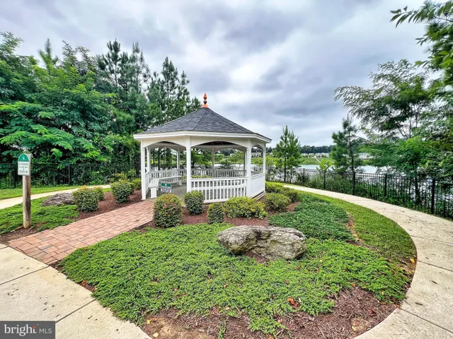 a view of a lake with houses in the back