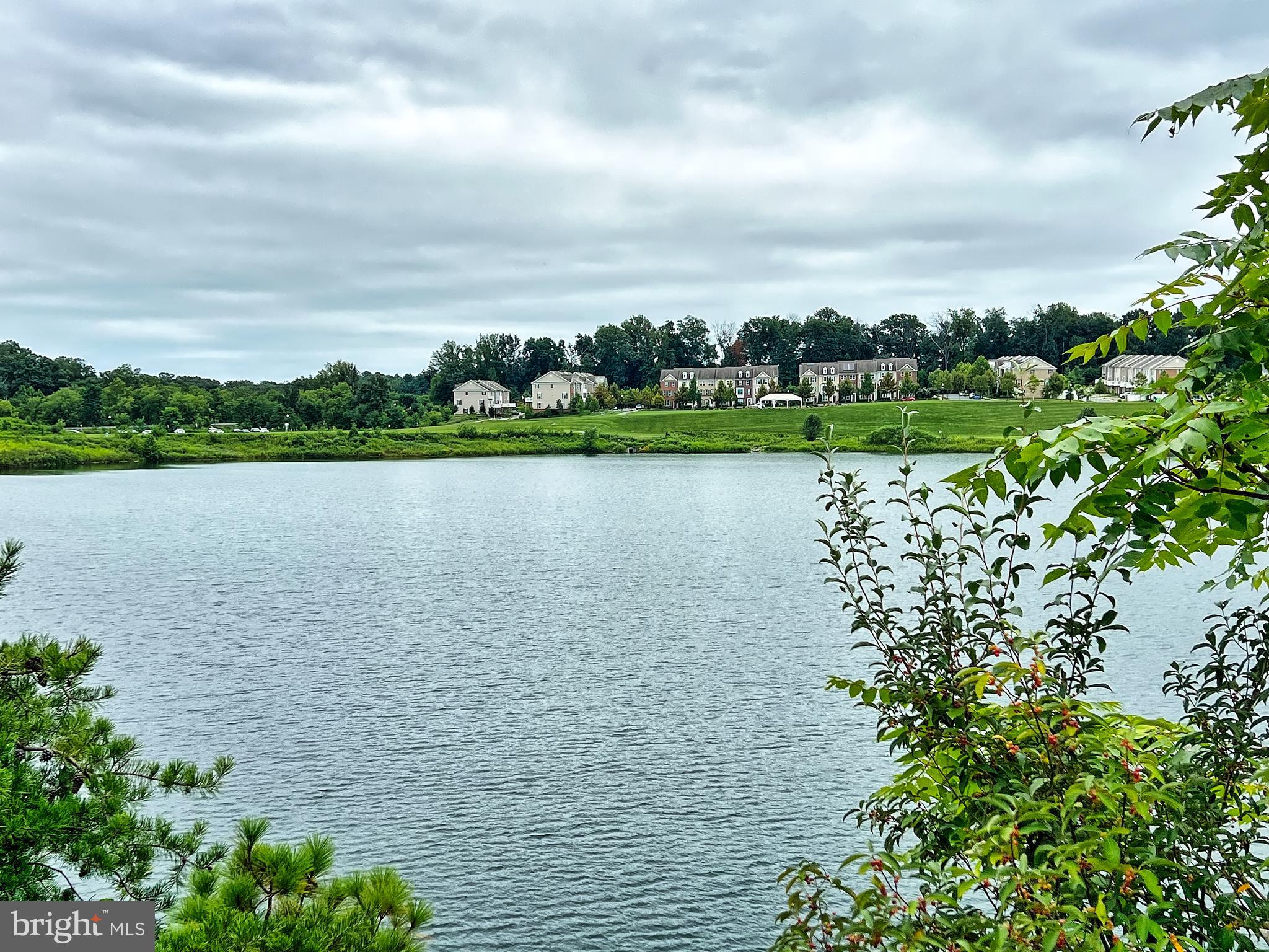 605 Quarry View Court, Unit 307 Reisterstown, MD 21136 - Photo 28 of 30 a view of a lake with houses in the back