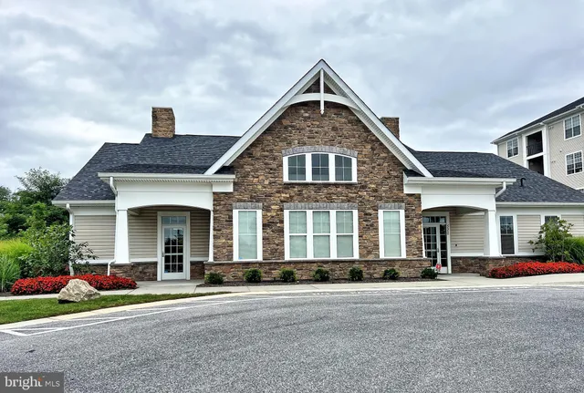 a swimming pool view with a seating space