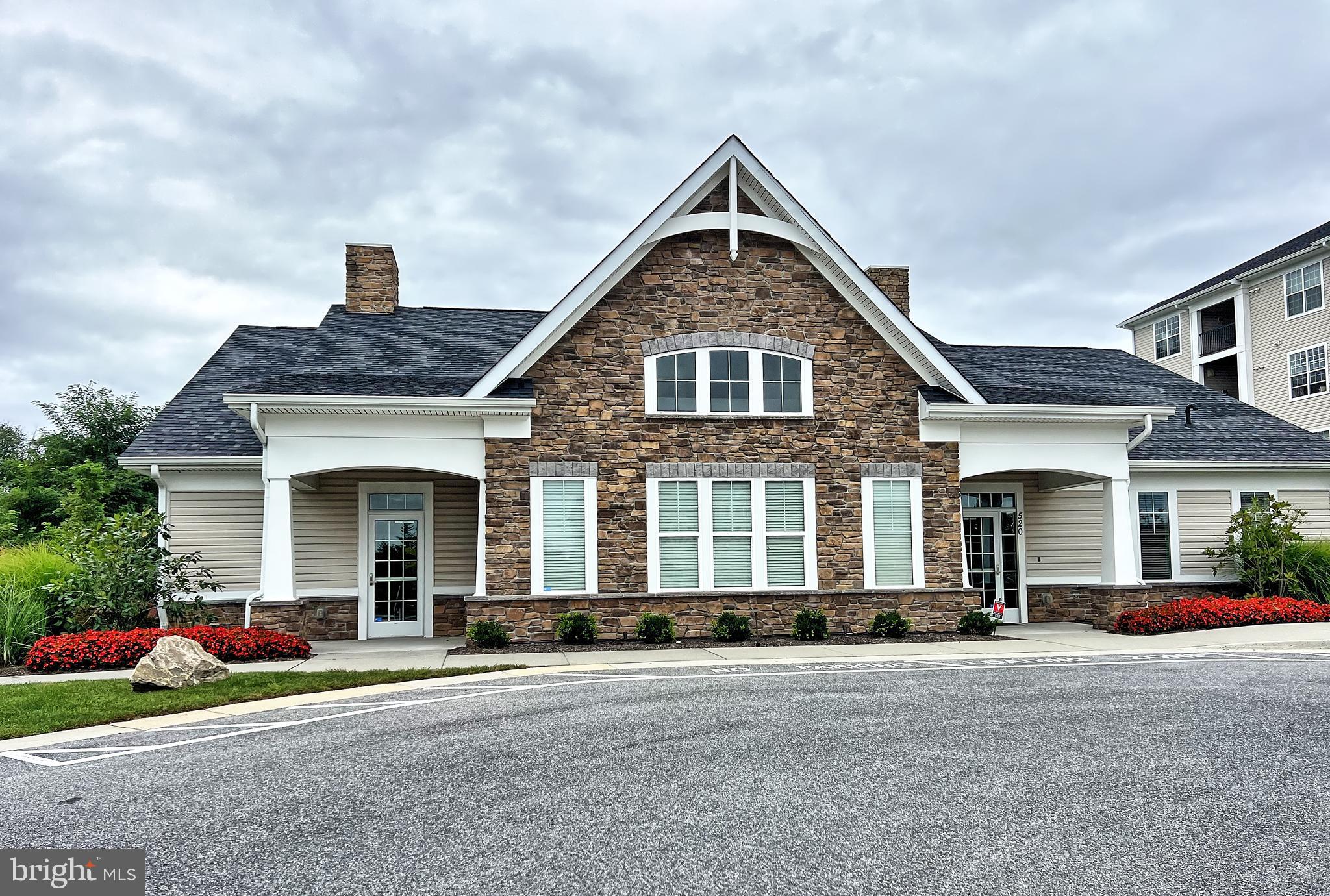 605 Quarry View Court, Unit 307 Reisterstown, MD 21136 - Photo 29 of 30 front view of a house with a yard