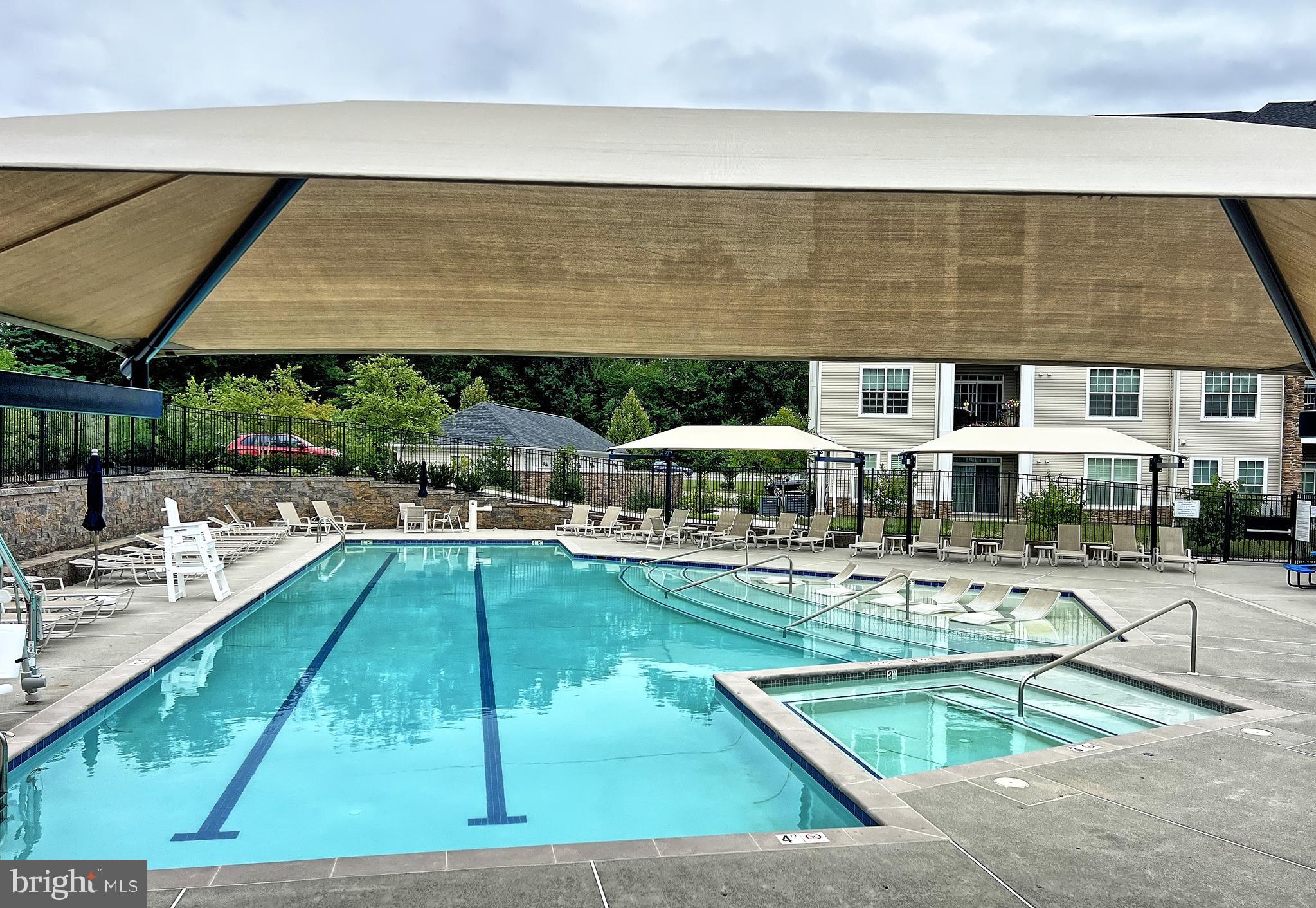 605 Quarry View Court, Unit 307 Reisterstown, MD 21136 - Photo 30 of 30 a swimming pool view with a seating space