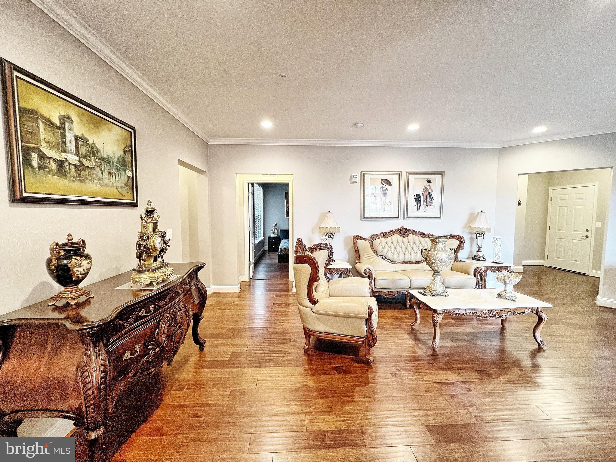 605 Quarry View Court, Unit 307 Reisterstown, MD 21136 - Photo 8 of 30 a living room with fireplace furniture and wooden floor