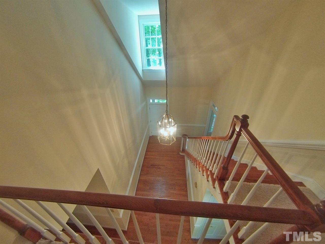 3312 Wade Avenue Raleigh, NC 27607 - Photo 2 of 13 a view of staircase with railing and white walls