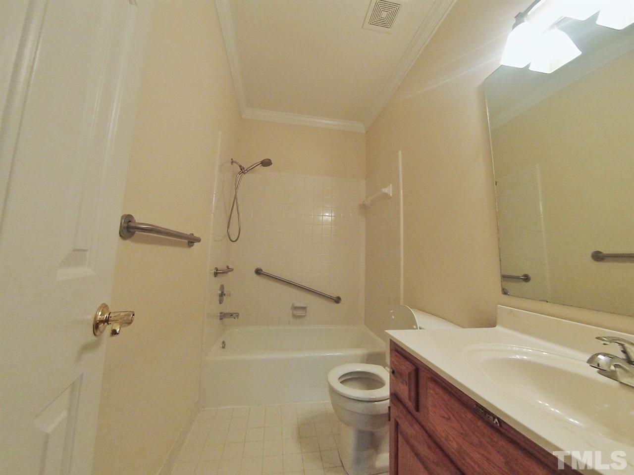 3312 Wade Avenue Raleigh, NC 27607 - Photo 6 of 13 a bathroom with a sink a toilet and shower