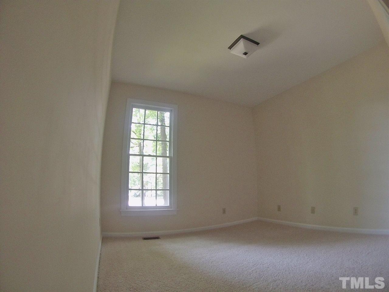 3312 Wade Avenue Raleigh, NC 27607 - Photo 7 of 13 an empty room with a window