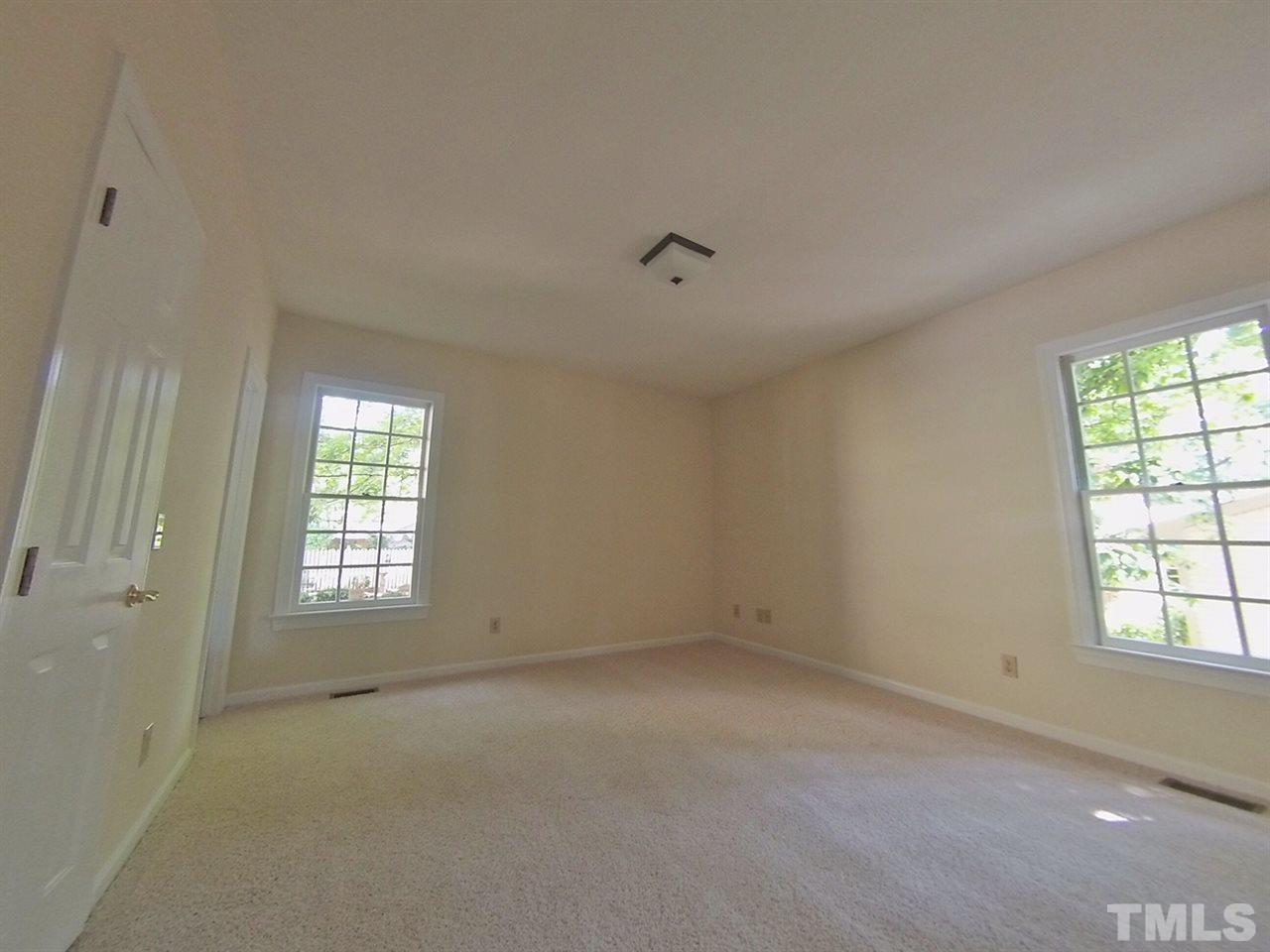 3312 Wade Avenue Raleigh, NC 27607 - Photo 9 of 13 a view of an empty room with a window