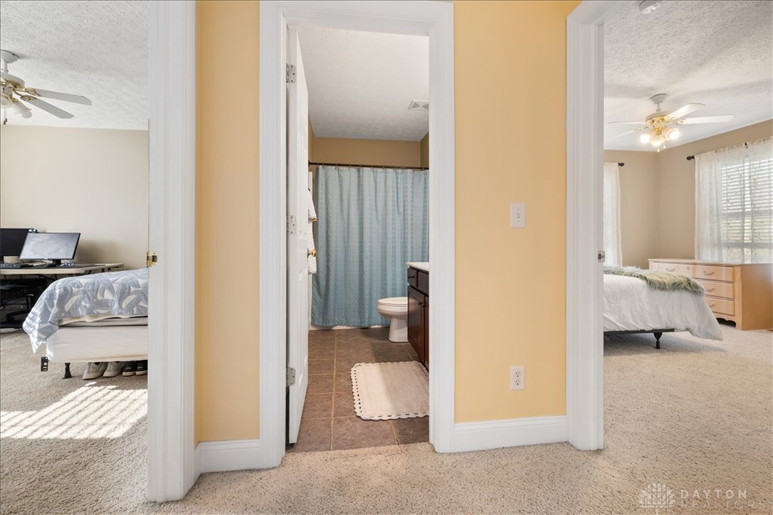 841 Willow Road Springfield, OH 45502 - Photo 24 of 64 This spacious layout connects comfortable sleeping areas with a functional bathroom.