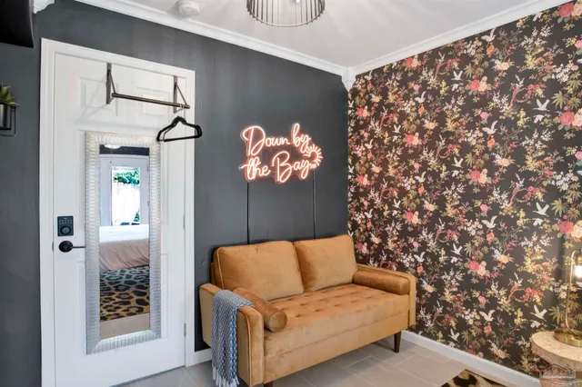 a blue couch sitting in front of a window