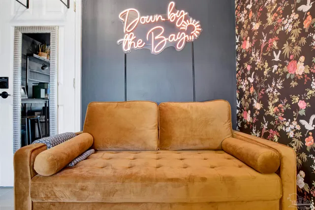 a large bed sitting in a bedroom next to a cabinet