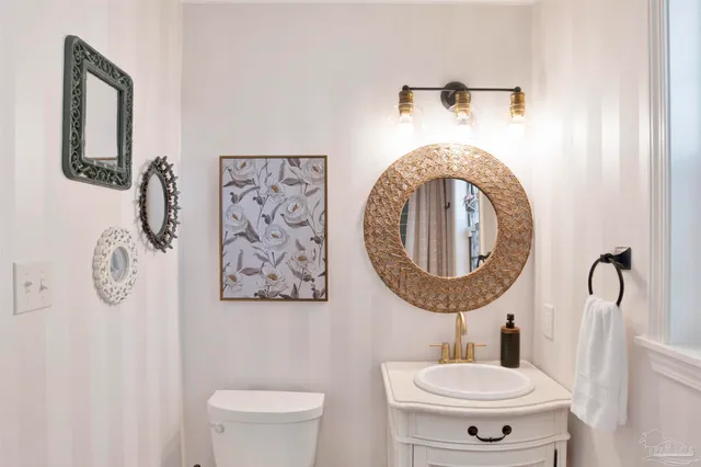 a bathroom with a toilet and a sink