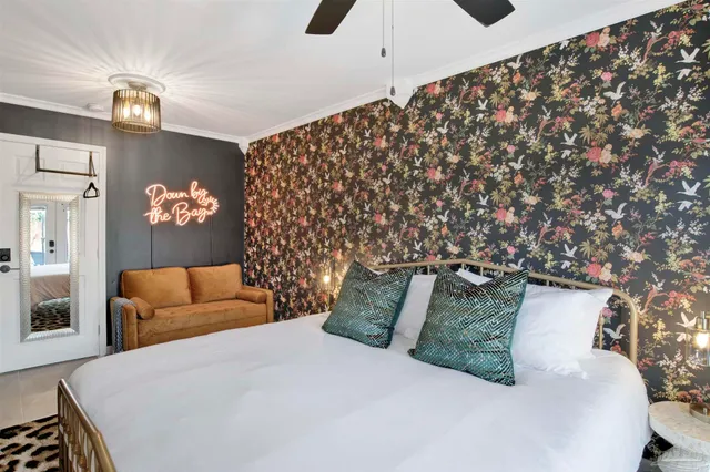 a bedroom with bed and a couch