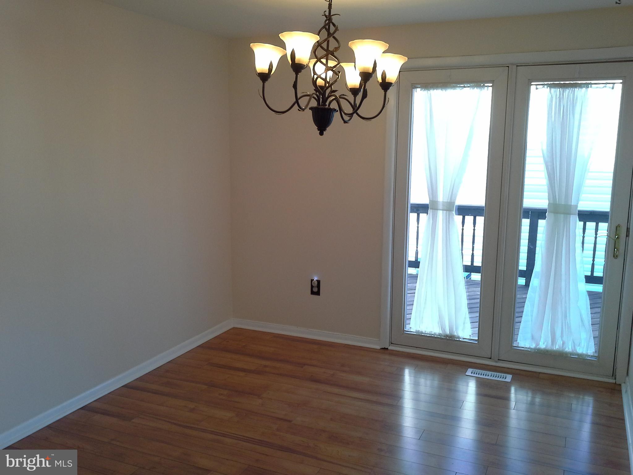 9315 Beowulf Circle Baltimore, MD 21237 - Photo 12 of 28 Dining Room w/sliders to deck
