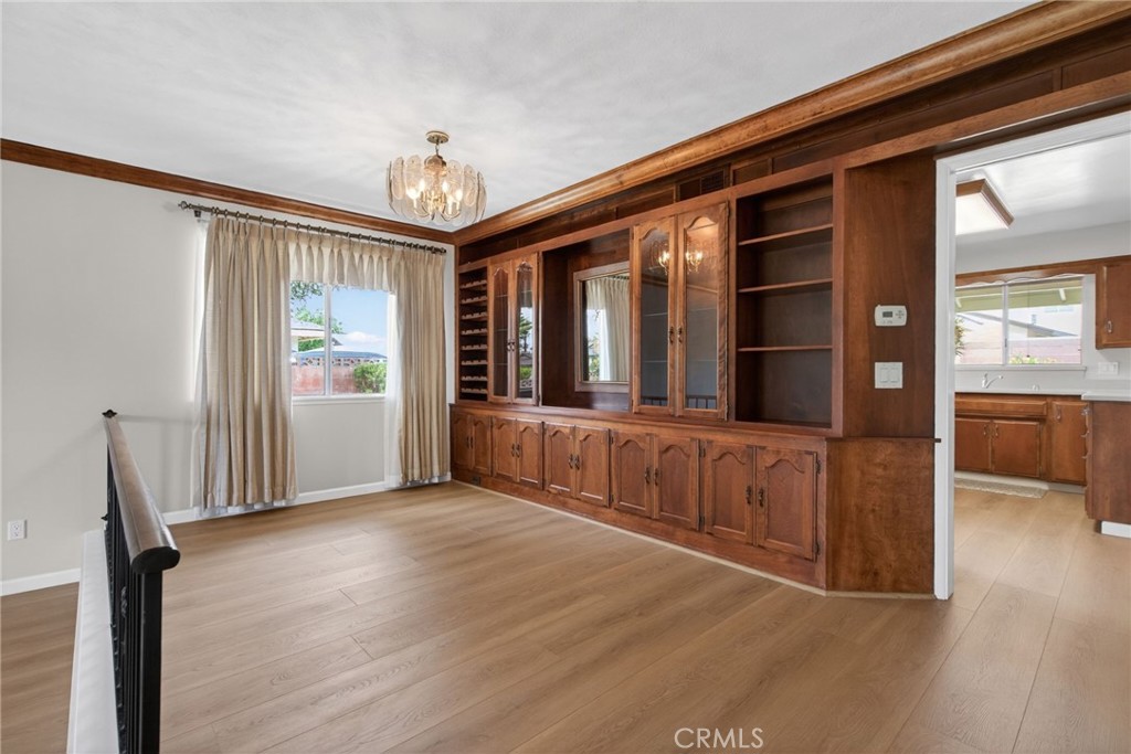 4963 Carlingford Avenue Riverside, CA 92504 - Photo 5 of 33 a view of a hallway with wooden floor and staircase