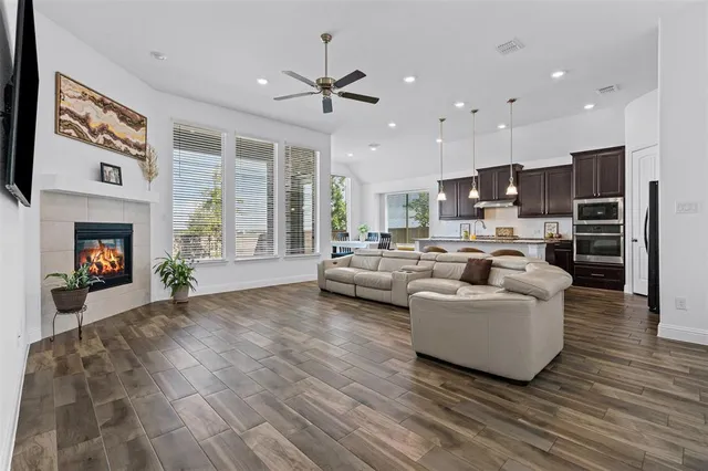 a living room with furniture and a fireplace