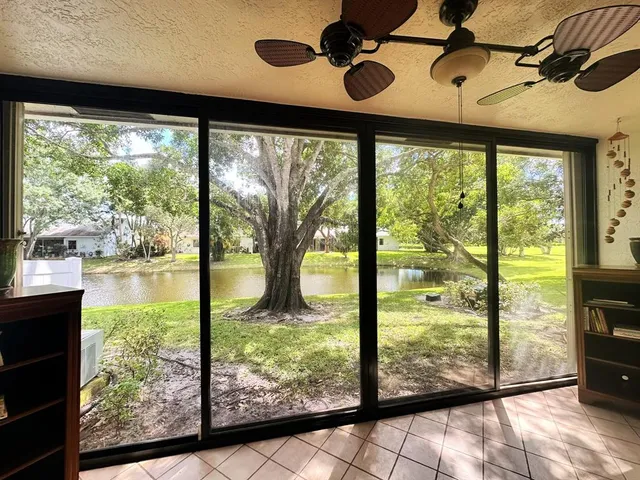 a view of a large window with a yard