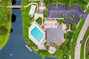 an aerial view of a house with a swimming pool
