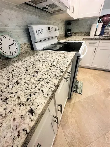 a kitchen with a stove and a sink