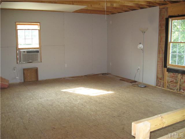 3119 Stanhope Avenue Raleigh, NC 27607 - Photo 16 of 18 an empty room with windows