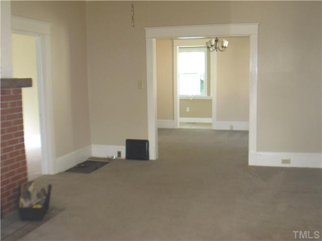 3119 Stanhope Avenue Raleigh, NC 27607 - Photo 3 of 18 a view of an empty room with a window