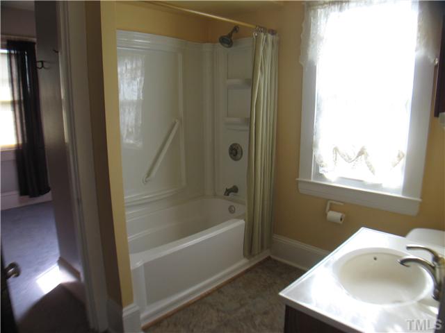 3119 Stanhope Avenue Raleigh, NC 27607 - Photo 5 of 18 a bathroom with a bathtub and a sink