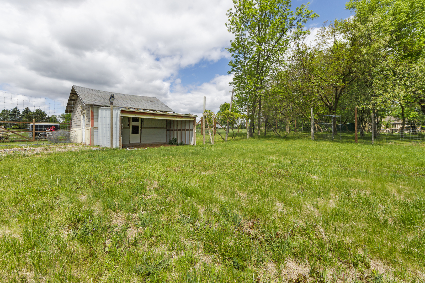 9909 Winn Road Spring Grove, IL 60081 - Photo 100 of 100 a view of a house with a big yard and large trees
