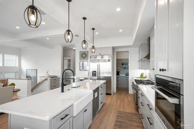 a large kitchen with a table and chairs