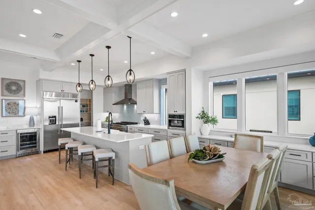 a spacious bathroom with a double vanity sink a mirror and shower