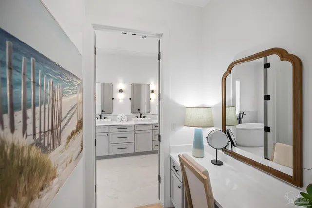 a large bedroom with a bed and large window