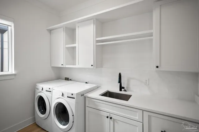 a bathroom with a shower and a glass door