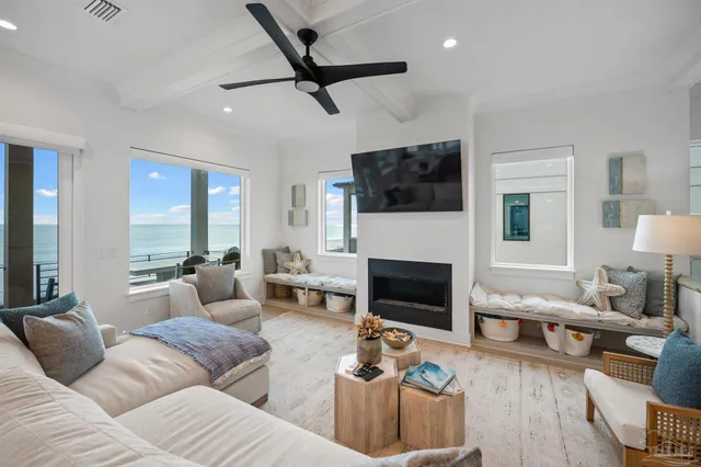 a living room with fireplace furniture and a flat screen tv