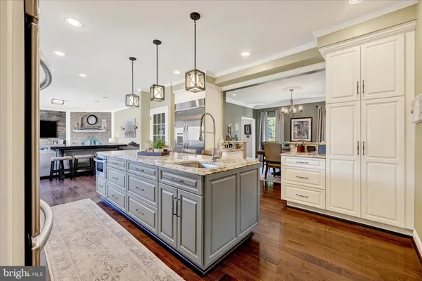 a view of a dining room with furniture chandelier and wooden floor