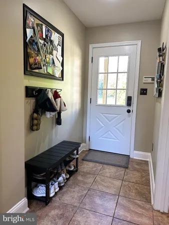an aerial view of a house with a garden and lake view