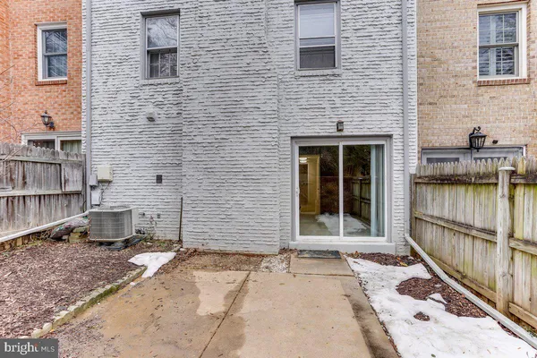 a brick building with a door and a window