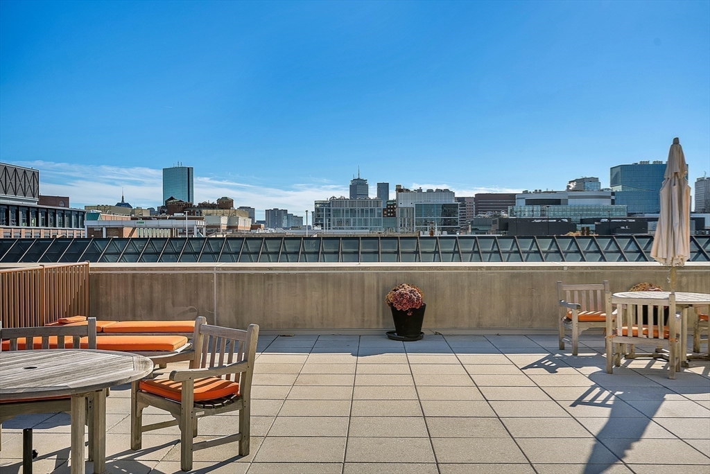 17 Otis Street, Unit 602 Cambridge, MA 02141 - Photo 15 of 40 a view of a terrace with chairs