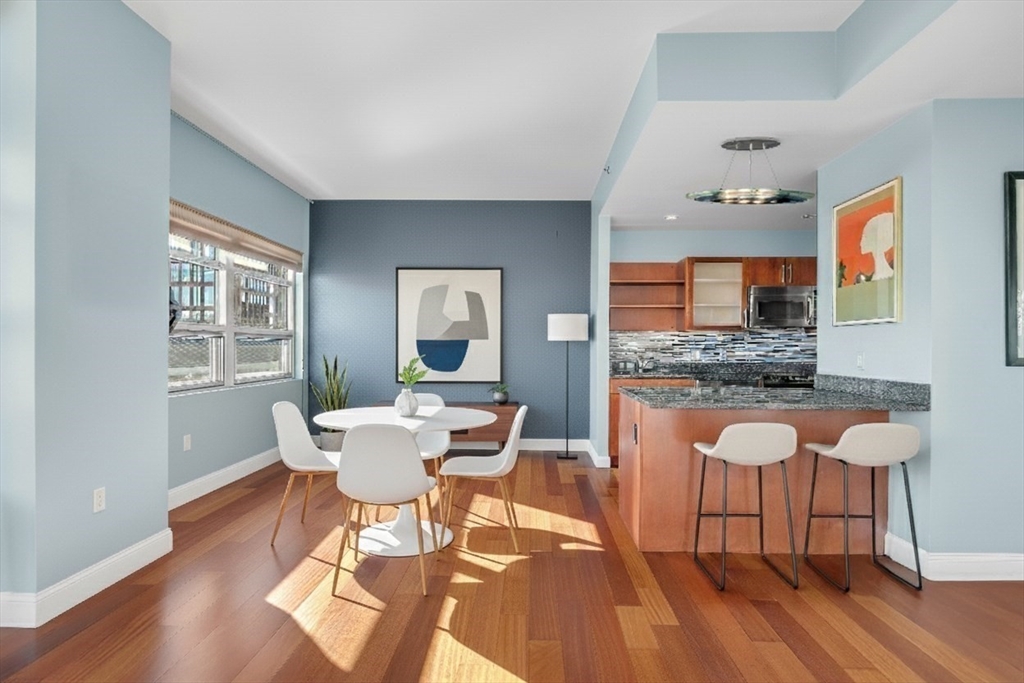 17 Otis Street, Unit 602 Cambridge, MA 02141 - Photo 29 of 40 a dining room with furniture and wooden floor