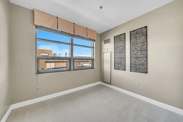 a view of livingroom with hardwood floor and hallway