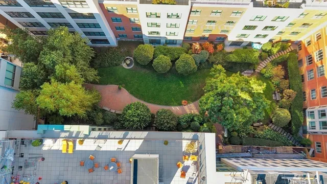 an aerial view of a house with a swimming pool