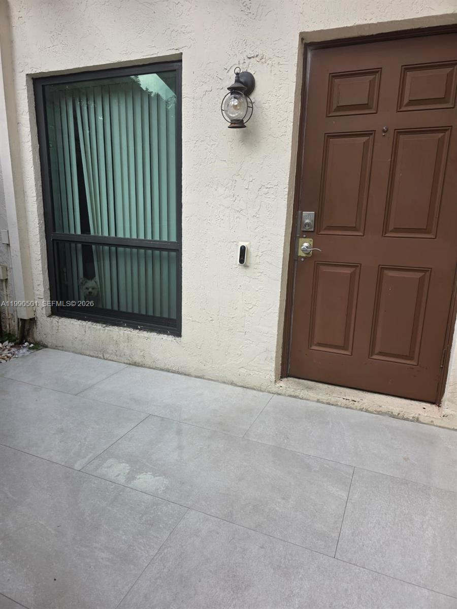 893 Southwest 120th Way Davie, FL 33325 - Photo 2 of 22 an empty room with windows