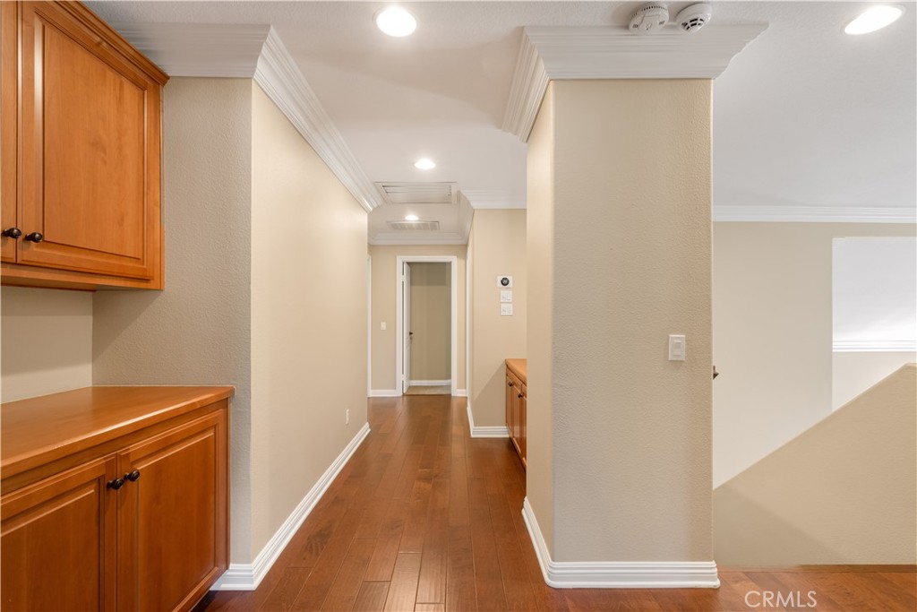 33351 Nicholas Common Temecula, CA 92592 - Photo 23 of 42 a view of a hallway with wooden floor