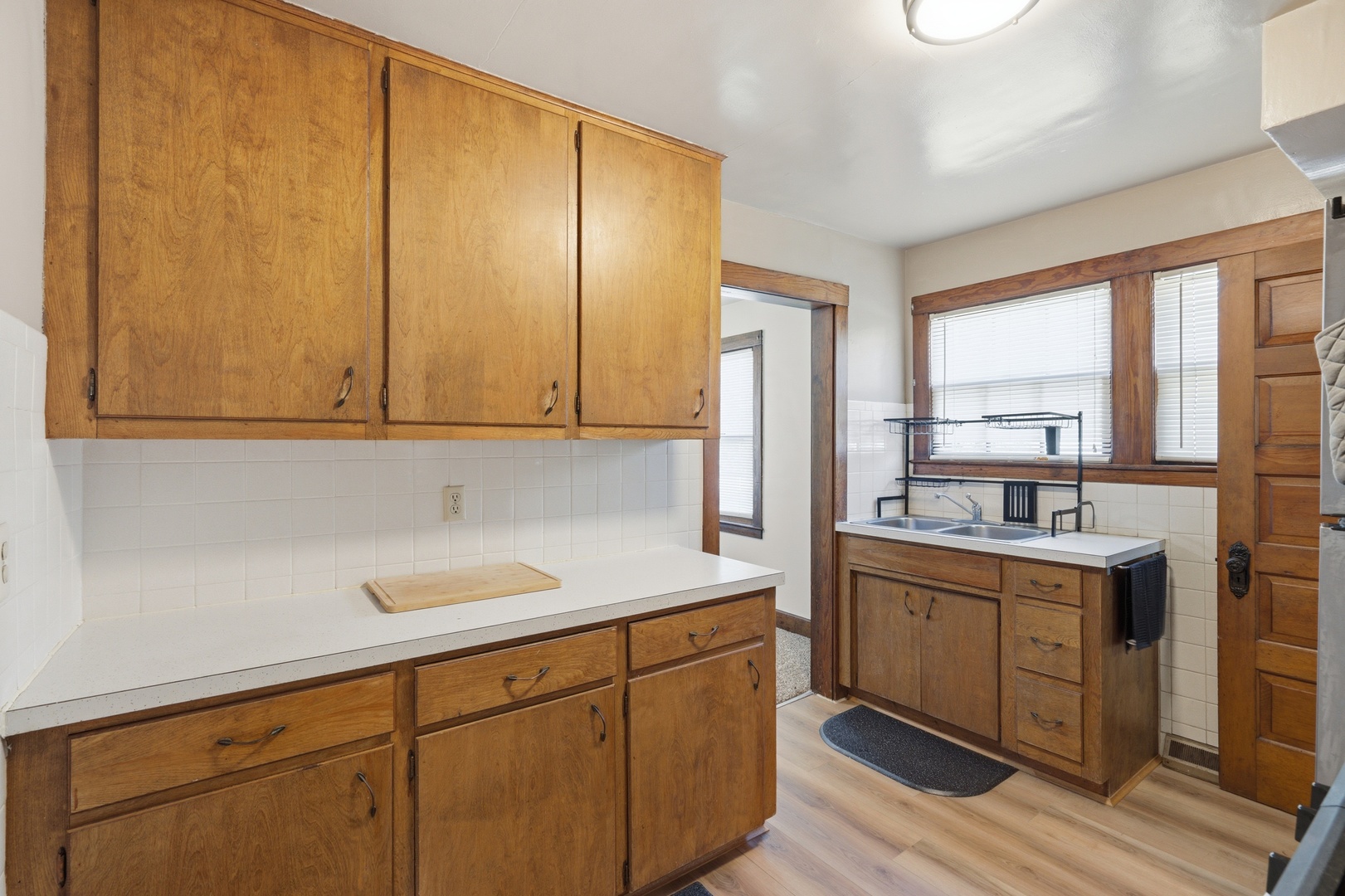 1908 24th Street Moline, IL 61265 - Photo 11 of 32 a kitchen with stainless steel appliances granite countertop a sink a stove and a refrigerator