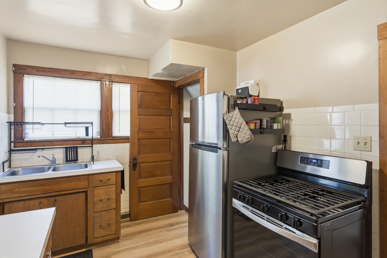 1908 24th Street Moline, IL 61265 - Photo 12 of 32 a kitchen with refrigerator a stove and a sink