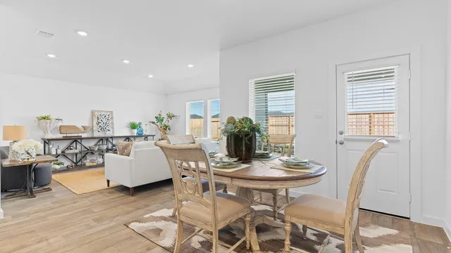 a living room with furniture and windows