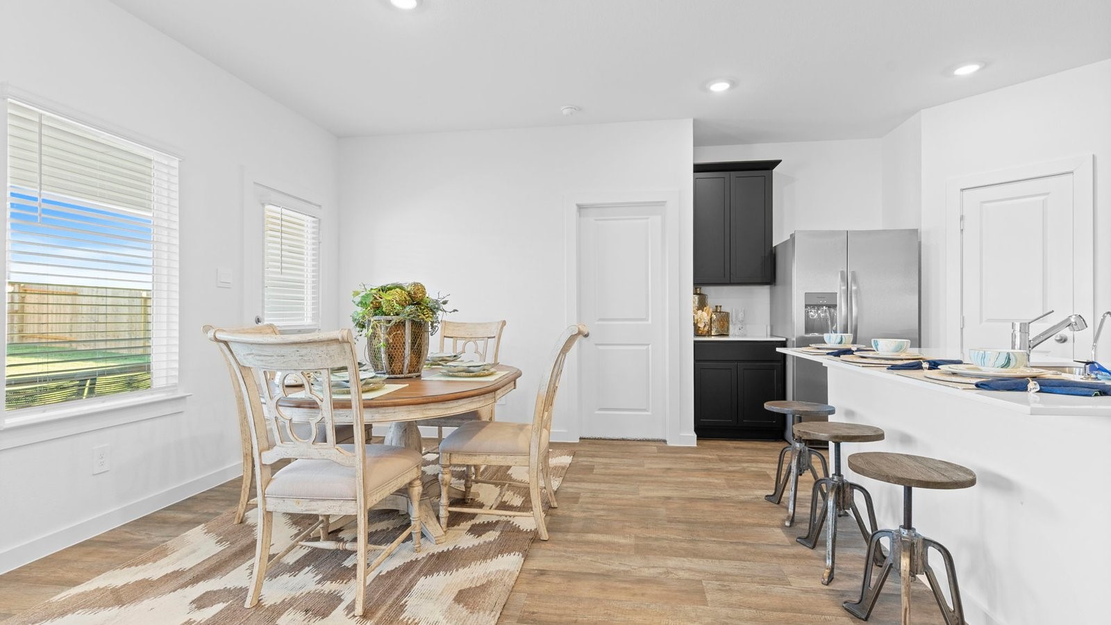 5928 Hawthorne Gdns Drive Rosenberg, TX 77469 - Photo 17 of 41 a view of a dining room with furniture and wooden floor