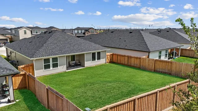 a view of a swimming pool with a garden and deck
