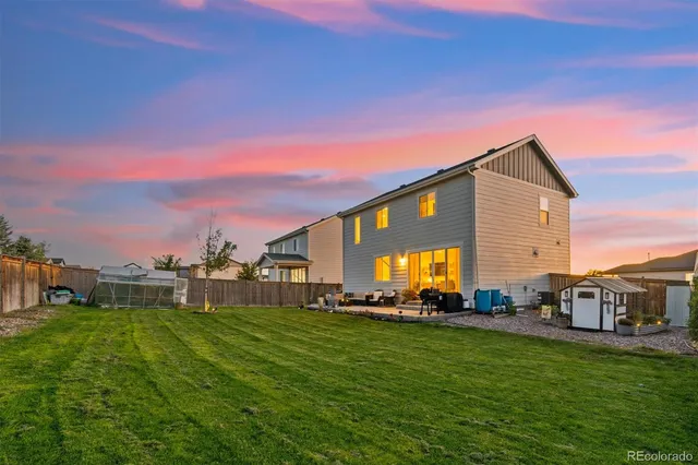 a front view of house with yard and trees